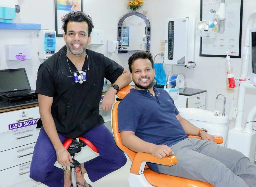 Dr Rajat Sachdeva with a patient at his Delhi clinic